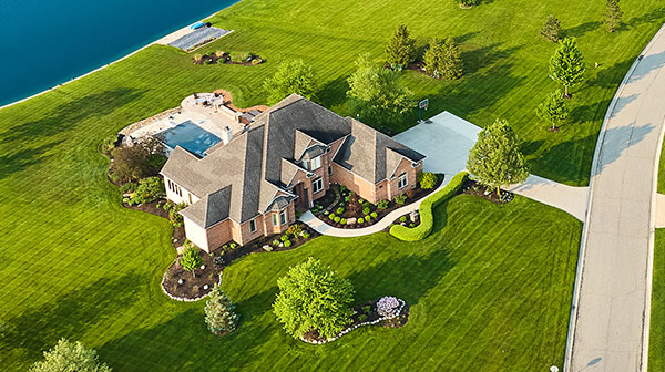 Solar-Farm-Inspections-600 Drone Photography for Commercial and Residential Real Estate - image of drone over an expensive home